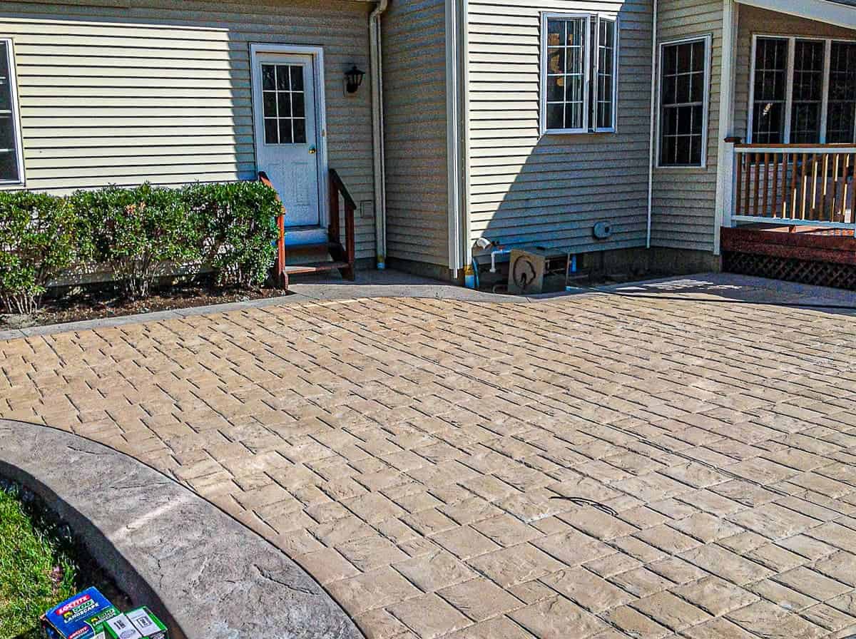 Tan and grey concrete paver patio.