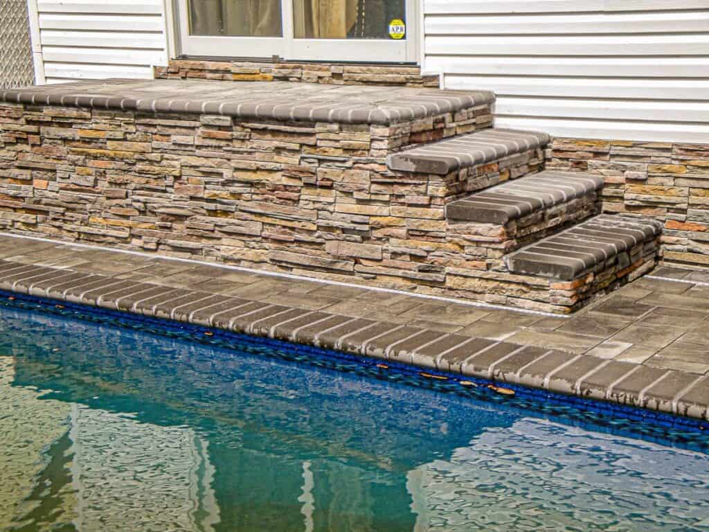 Four level stairs matching the coping of the pool.