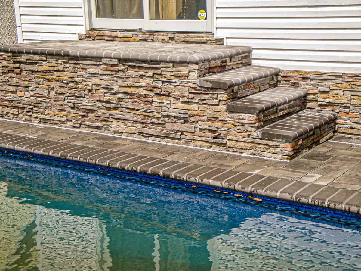 Four level stairs matching the coping of the pool.